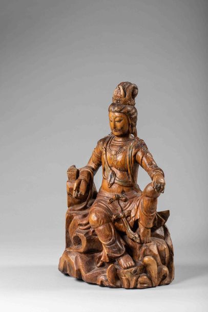 null Le Boddhisattva Kwan Yin Avalokitésvara assis en délassement sur un rocher vêtu...