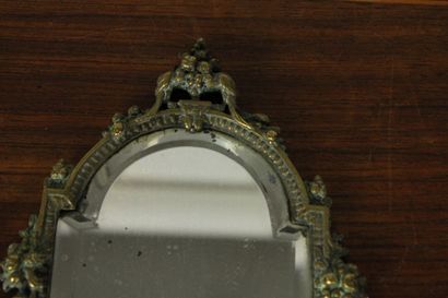 null Hand mirror in chased bronze decorated with scrolls and stylized flowers. 19th...