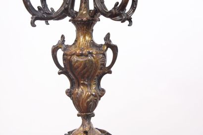 null Mantelpiece in regula with brown patina, the clock of movement with scrolls...