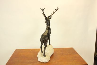 null School of the XIXth. Sculpture in chased metal representing a deer on a white...
