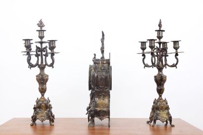null Mantelpiece in regula with brown patina, the clock of movement with scrolls...