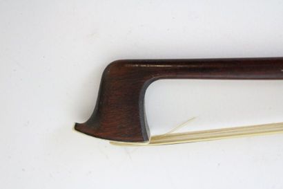 null Violin bow by Emile François Ouchard signed, in pernambuco mounted nickel silver....