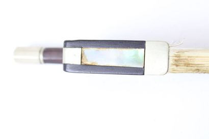 null Violin bow by Emile François Ouchard signed, in pernambuco mounted nickel silver....
