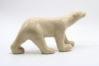  In the taste of François POMPON (1855/1933): Large white bear in cracked ceramic.
Length:... Gazette Drouot