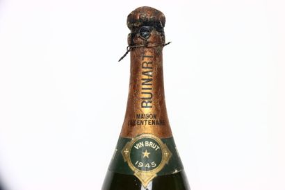null 1 bottle of white CHAMPAGNE BRUT 1945, RUINART. Cap and back label damaged....