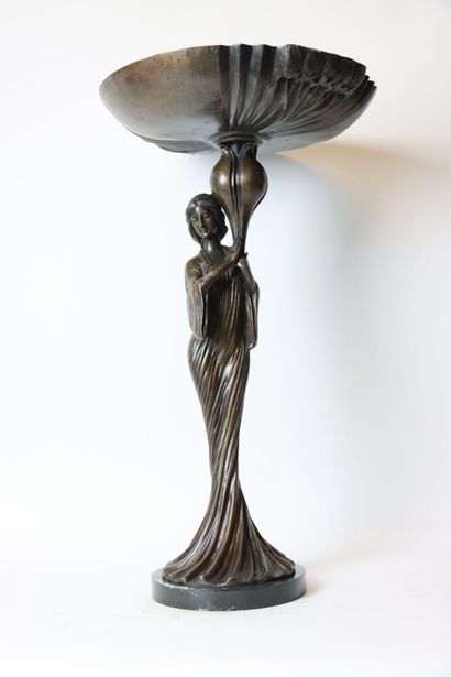 null Young woman in long dress supporting a large cup, bronze sculpture of Art Nouveau...