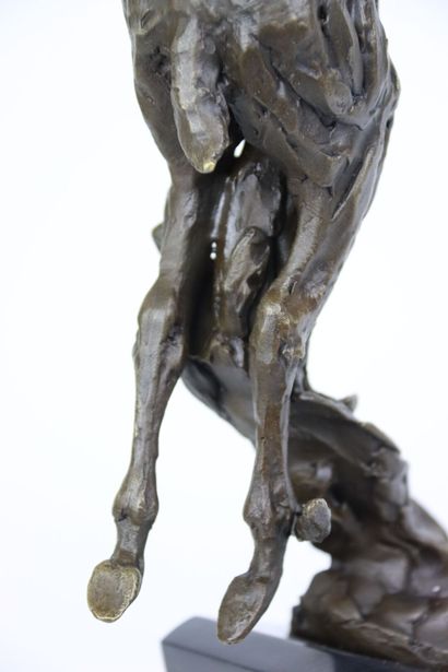 null A. BARGE (XXth century), Le saut du cerf, bronze signed, black marble base....