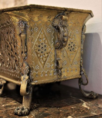 null Planter in gilded brass decorated with fantastic animals and mascarons.
Dimensions:...