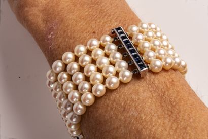 null Bracelet holding five rows of white cultured pearls (untested) interspersed...