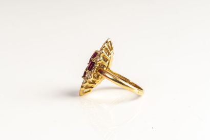 null 18K (750/1000) yellow gold marquise ring, set with four faceted oval rubies,...