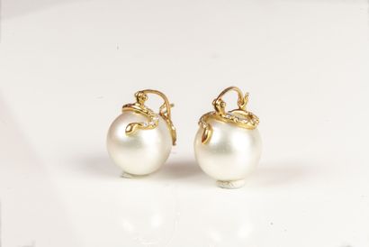 null Sleeper earrings made of South Sea cultured pearls, decorated with a small diamond-paved...