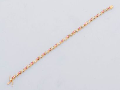 null Line bracelet in 18-carat (750 thousandths) yellow gold set with shuttle rubies...