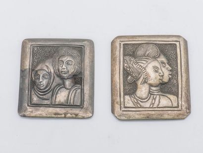 null Set of two rectangular silver plates in metal decorated with embossed characters.
Size:...