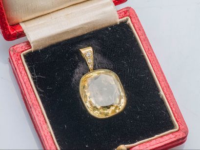 null Pendant set with an oval unheated Ceylon yellow sapphire of approximately 20...