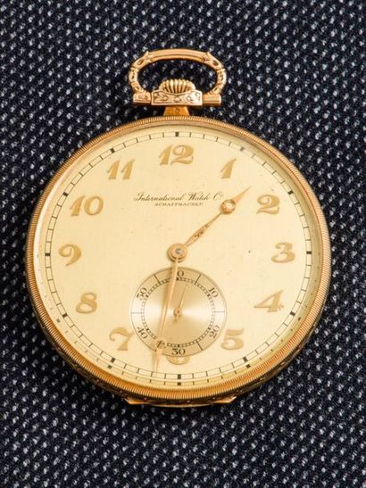 IWC Pocket watch in 14 carat yellow gold (585 thousandths). The guilloché background...