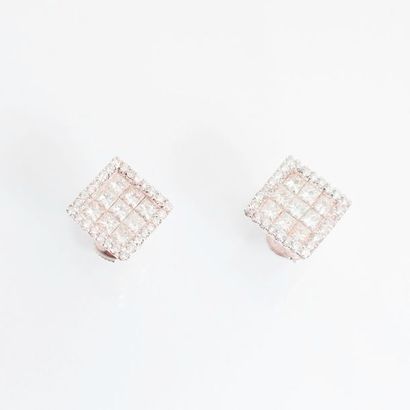 null Pair of 18 karat white gold (750 thousandths) square shaped earrings set with...