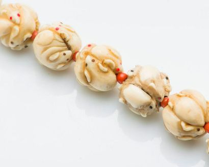 null Bracelet adorned with twelve ojime in marine ivory carved with mice alternating...