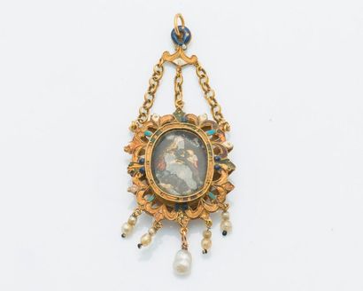 null 18 karat (750 thousandths) yellow gold pendant composed of a medallion set in...