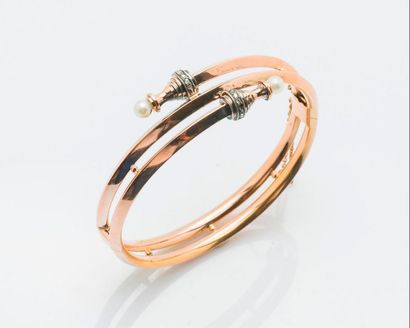 null Rigid bracelet opening in 9 carat (385 thousandths) pink gold, with a winding...