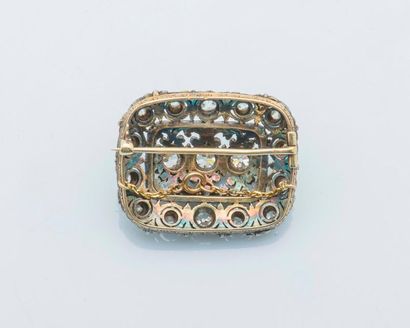 null 

Brooch of rectangular and domed shape in silver (925 thousandths) and 18 carat...
