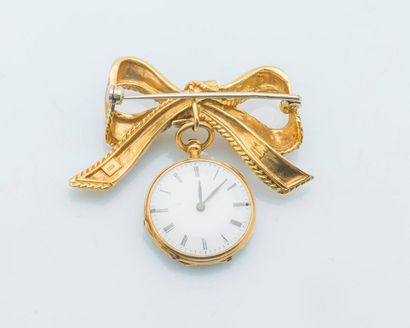 null Petite montre de col et sa broche nœud en or jaune 18 carats (750 millièmes),...