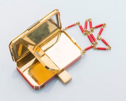 null Vanity case in 18 carat yellow gold (750 thousandths) red enamel and enhanced...