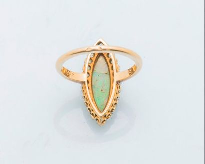 null Marquise ring in 18 carat yellow gold (750 thousandths) set with a broken opal...