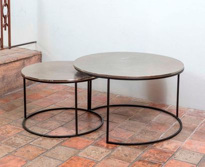 null Two round nesting tables with black lacquered metal legs and hammered metal...