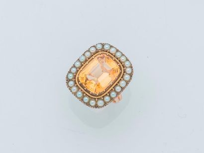 null Metal ring decorated with a rectangular citrine of about 5.9 carats in a surround...