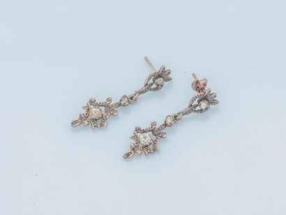 null Pair of silver earrings (800 thousandths) adorned with a floral motif retaining...