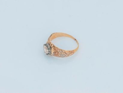 null 14 carat (585 thousandths) yellow gold ring set with a rose-cut diamond, the...