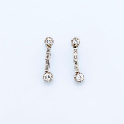 null Pair of platinum earrings (950 thousandths) each set in an articulated drop...