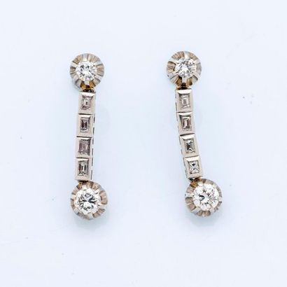 null Pair of platinum earrings (950 thousandths) each set in an articulated drop...