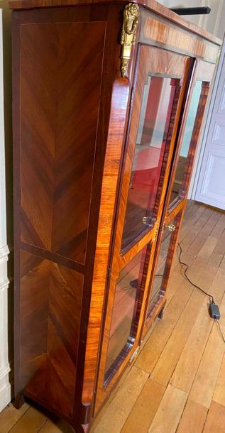 null Bookcase in mahogany inlaid veneer and mahogany veneer opening through two glass...