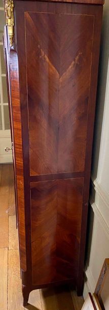 null Bookcase in mahogany inlaid veneer and mahogany veneer opening through two glass...