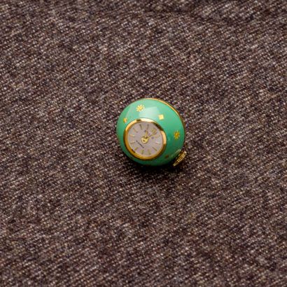 BUGSA Montre pendentif boule en métal doré, rehaussée d'émail vert d'eau et de motifs...