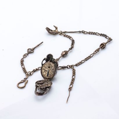 null Memento mori in silver plated metal forming a gusset watch accompanied by its...