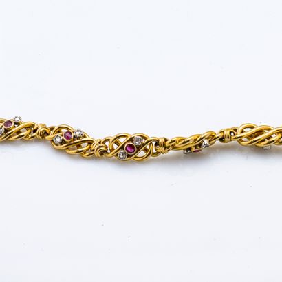 null Bracelet en or jaune 18 carats (750 millièmes) orné de neuf maillons en nœud...