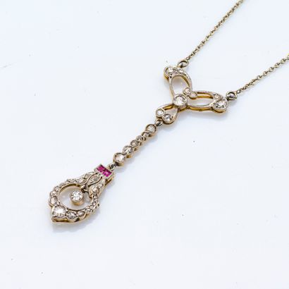 null Chain and its 18-carat (750 thousandths) white and yellow gold pendant adorned...