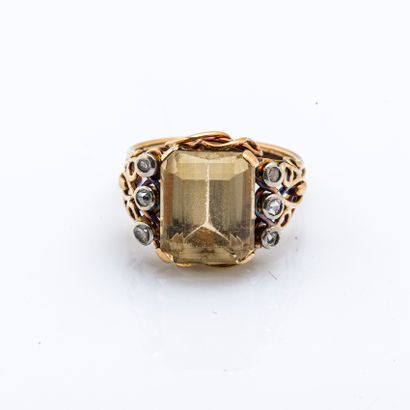 null 18 karat (750 thousandths) yellow gold ring set with an emerald-cut citrine...