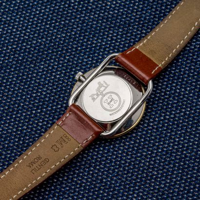 HERMES Paris, Steel and gilded steel Arceau model watch with clip-on back (logotypé)....