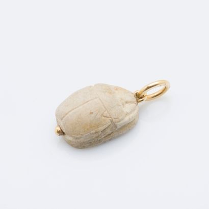 null 
Hard stone pendant stylizing a beetle, engraved with fancy hieroglyphics on...
