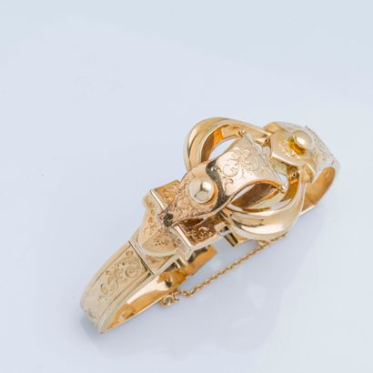null Bracelet semi-rigide en or jaune 18 carats (750 millièmes) formant une boucle...
