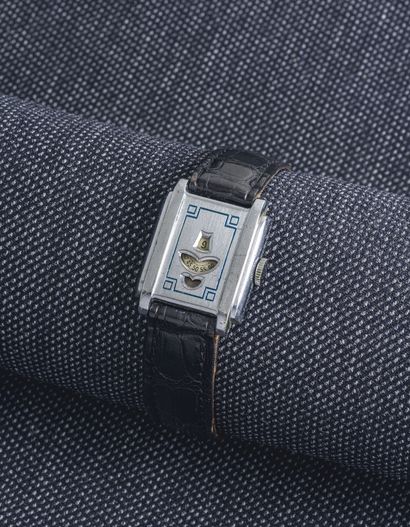OLYMPIC WATCH Co Circa 1930

Tank-shaped watch with a rectangular steel case with...