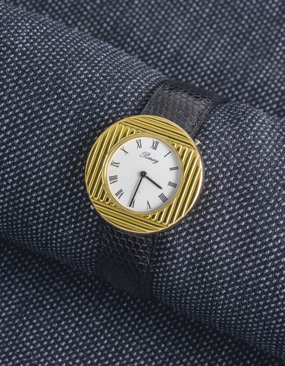 POIRAY MA PREMIERE

Round watch in steel and gilded steel with screwed back (signed...