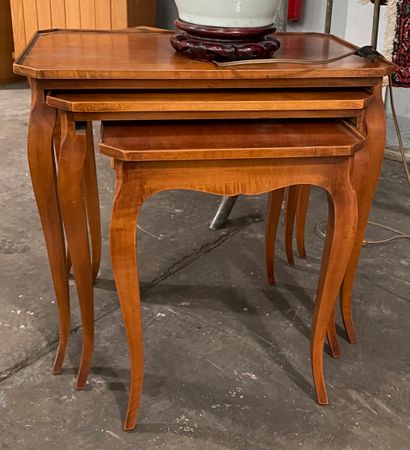 null Three veneer nesting tables on arched legs 

54 x 60 x 39 cm (for the large...