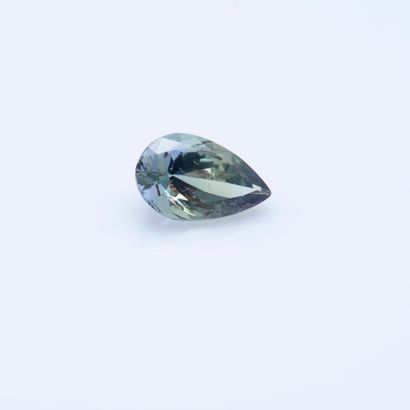null 3.02 carat drop size Tanzanite, accompanied by an IAG report.