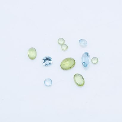 null Set of six peridots and four aquamarines on paper.

Gross weight: 3.9 carat...