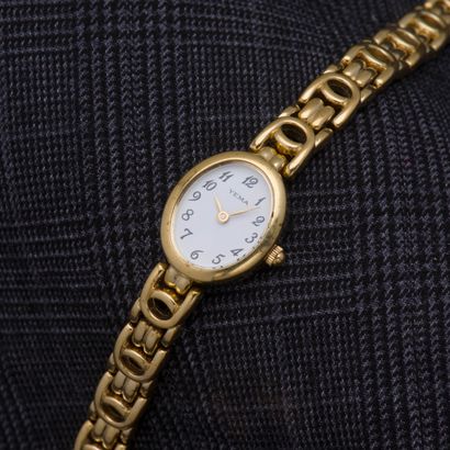 YEMA Montre bracelet de dame en métal doré, le boîtier de forme ovale à fond clippé,...
