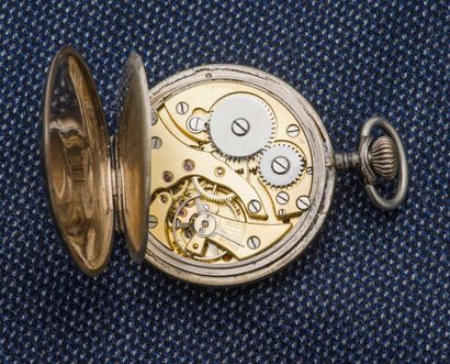 null A silver pocket watch (800 ‰), the polychrome enamelled dial decorated with...